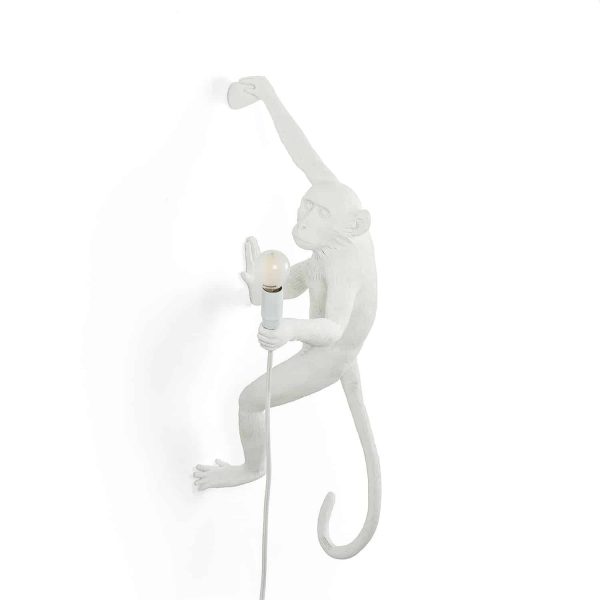 biały kinkiet w kształcie małpki